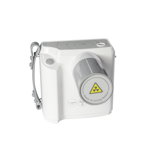 IDEN-X1 dental X-ray unit — alternate angle showing radiation warning label and wrist strap