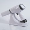IDEN-X2 handheld dental X-ray unit with charging dock — touchscreen display visible