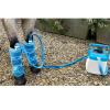IWA-SCT20 air compression cold therapy applied to equine front legs in stable yard